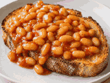 Beans on toast on a white plate